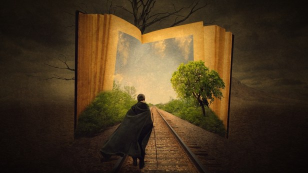 A boy in a cape walking down train tracks that lead into a book with bright blue sky and bushes around the opening.